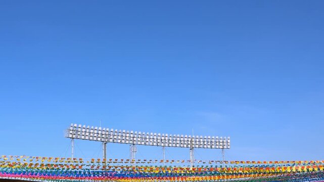 Stadium lights and colorful flags