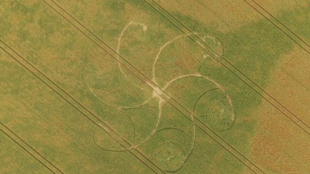 Aerial footage of a mysterious, intricate, geometric crop art, crop circle formation in a barley field near near Snap Hill, Kingweston, Somerset, England, UK; 10 May 2026