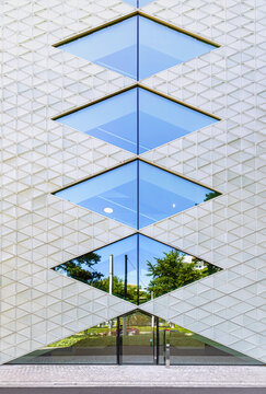 Basel,, Switzerland - June 15. 2026: The glass fasade of the headquarters of Helvetia Insurance company in Basel. Helvetia is an international insurance group.