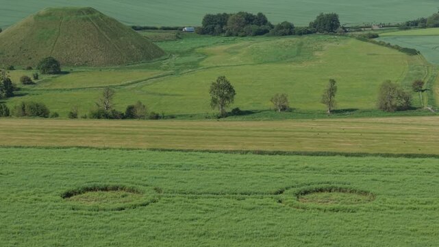 Aerial footage of a mysterious, intricate, geometric crop art, crop circle formation in a barley field near Waden Hill, Silbury Hill, West Kennet Avenue, Avebury, Wiltshire, England, UK; 29 April 2026