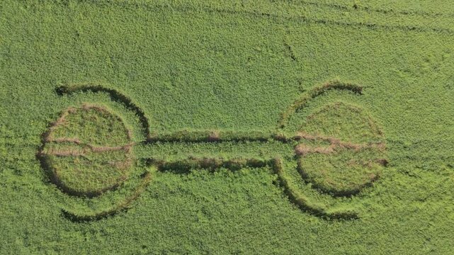 Aerial footage of a mysterious, intricate, geometric crop art, crop circle formation in a barley field near Waden Hill, Silbury Hill, West Kennet Avenue, Avebury, Wiltshire, England, UK; 29 April 2026