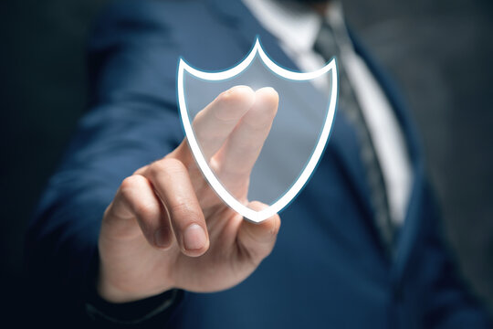 a man taps on a screen with a virtual shield