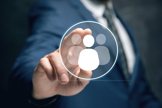 businessman holding a social network icon on a dark background, man and people icon