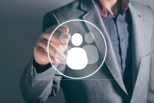 businessman holding a social network icon on a dark background, man and people icon