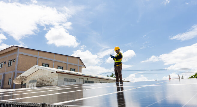Solar panel installation rooftop energy industry urban environment worker viewpoint renewable energy concept