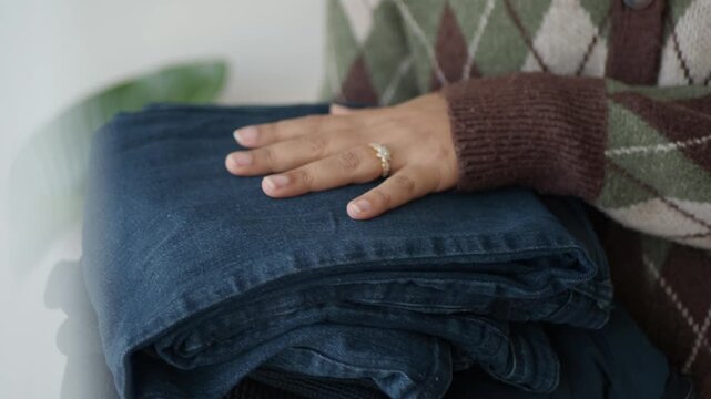 Sorting and organizing clothes at home for better storage