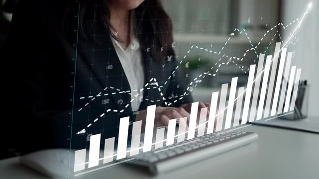 A business professional analyzes digital financial data on a holographic interface, showcasing growth and trends in a modern office environment. Copula
