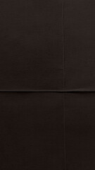 Fototapeta premium Dark brown textured paper background, perfect for mobile wallpaper.