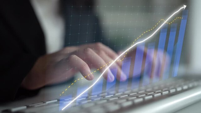 A close-up of a person typing on a keyboard, with a digital financial chart overlay showing growth trends in a modern office setting, symbolizing business success. Copula