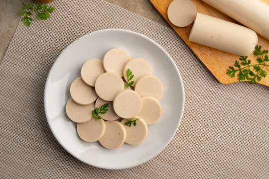 Sliced vietnamese sausage or White Pork Sausage in white plate.asian food.Top view
