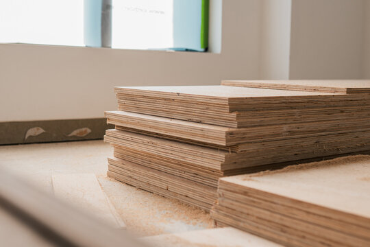 Stack of wooden boards on a construction site, building materials plywood board