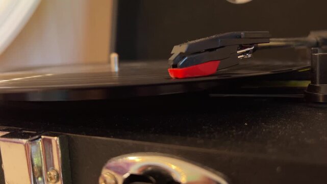 Vinyl record spinning on a turntable close up