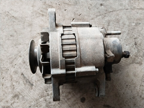 Automotive Alternator Part on Textured Surface