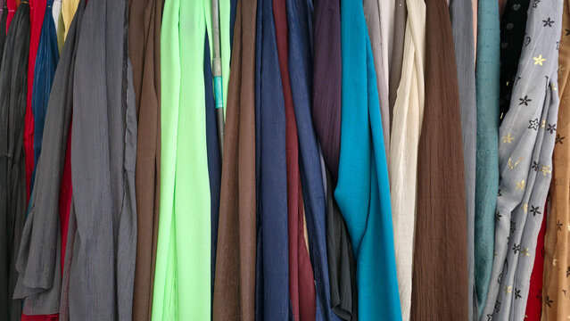 Colorful fabric textures hanging in a row