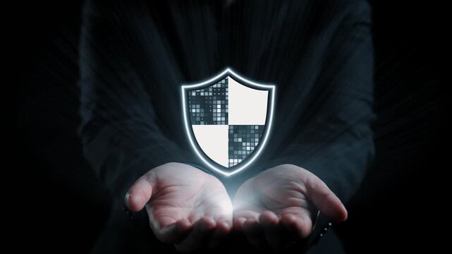 A pair of hands cradles a virtual security shield, symbolizing the importance of cyber protection in today digital landscape, with visual elements of data security. Qubit