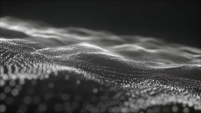 Abstract glowing digital particles flowing in undulating waves against a dark background with subtle depth of field creating a futuristic motion concept