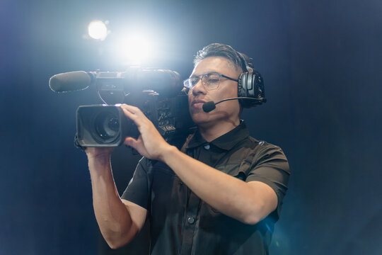 Cameraman operating camera during live broadcast production