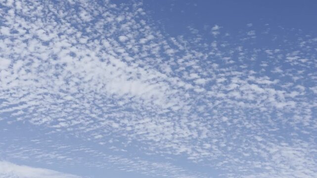 Time lapse of cirrocumulus clouds in a blue sky