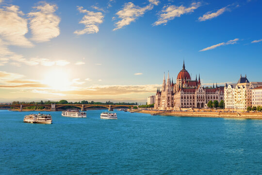 Stunning sunset over the Hungarian Parliament Building and Danube river in Budapest