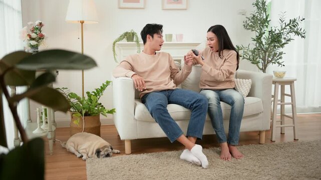 Quarrel Between Asian Couple Revealing Issues of Infidelity and Emotional Distance in a Cozy Setting
