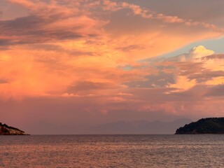 Fototapeta premium Greek Island Harbor at Sunset with Dramatic Golden Sky