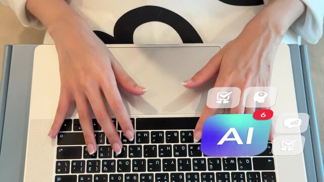 Overhead shot of an East Asian woman typing quickly on a laptop keyboard in a living room, displaying 3D tracked artificial intelligence overlay badges with data bar charts, virtual gears, and notific