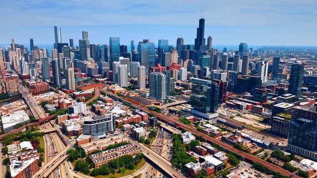 Busy streets of modern metropolis with hectic traffic at daytime. Lifestyle of Chicago, Illinois, USA. Aerial view.
