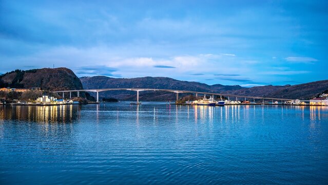 Maloy in Norway shows the beauty of morning light reflecting on water with the bridge and hills in the background