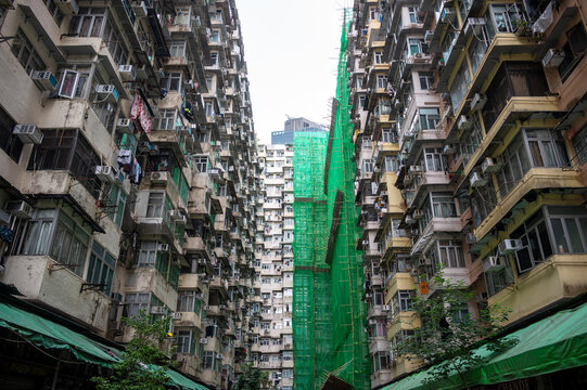 Dense full-frame facade of the famous overcrowded residential Monster Building complex in Quarry Bay, Hong Kong