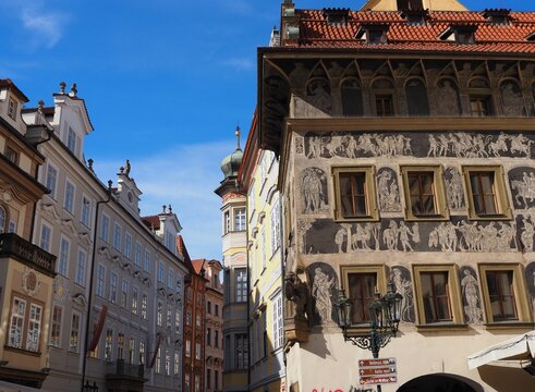 Historic House at the Minute on Old Town Square in Prague, Czech Republic. The Renaissance facade decorated with sgraffito artwork, rich architectural heritage Prague's historic center.