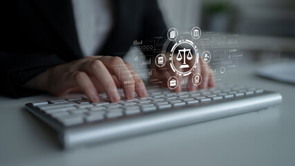 Professional Hands Typing on Keyboard with Legal Icons and Data Graphics in Modern Office Setting...