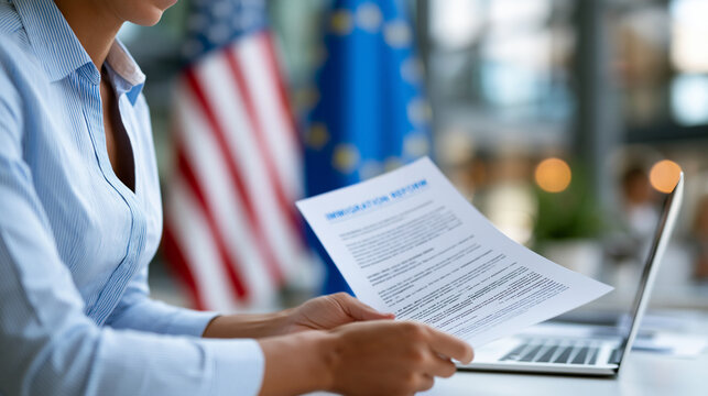 Cropped view of an anonymous woman holding a document with immigration reform text near American and European flags, legal and political documentation concept, faceless,