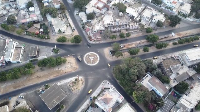 Timelapse aerial drone over busy Dakar Senegal traffic roundabout