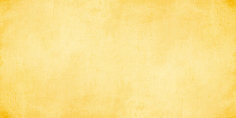 Fototapeta premium Yellow vintage grunge paper background texture with vignette borders for retro design and backdrop concepts. Vintage, aged paper look with subtle stains, scratches, and darker vignette borders
