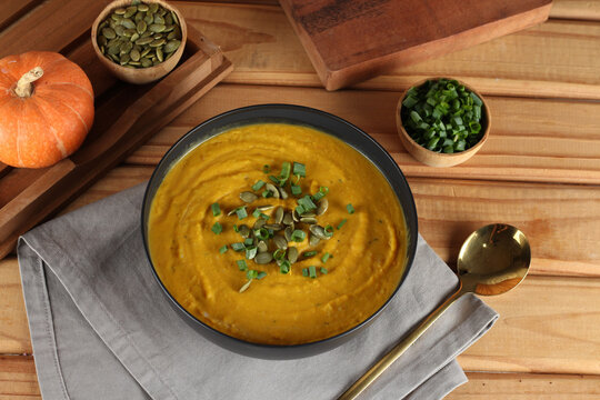 Creamy pumpkin soup with toasted pumpkin seeds and herbs.