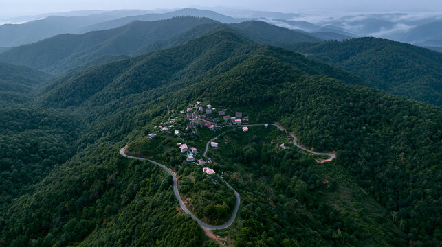 Secluded mountain hamlet unfolding beneath the vast sky and rolling hills