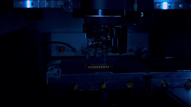 Premium low key close up shot of robotic precision assembly in a dark room. Sharp metallic reflections. Metaphor for R&D innovations and advanced hardware.