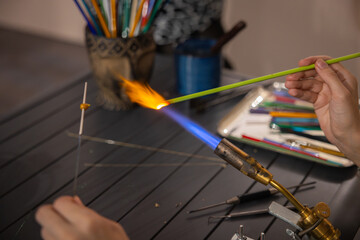 Obraz premium Lampworking Making glass bead. Lampwork studio 