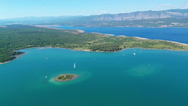 Azure waters, lush islands, and distant mountains define the stunning Croatian Adriatic. A speedboat cuts through the clear sea, inviting summer adventures. Klimno