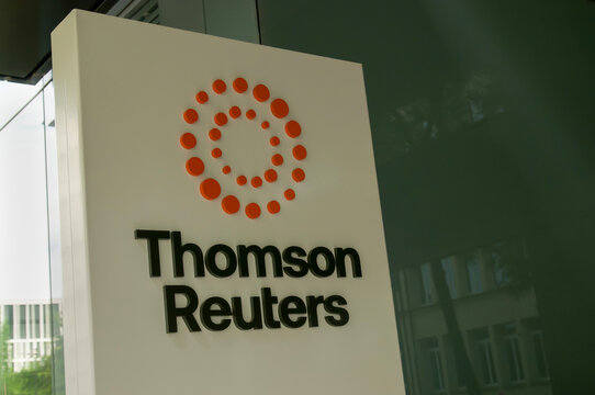 Thomson Reuters corporate logo sign close up at office headquarters in Zug