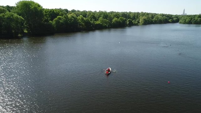 Drone smoothly following boat on Moscow pond