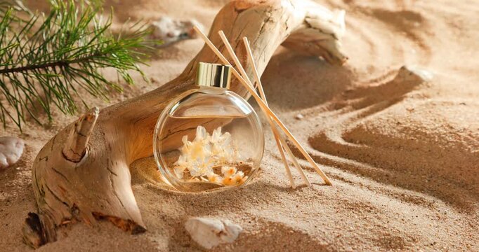 Intense fragrance diffuser on sandy beach in summer.