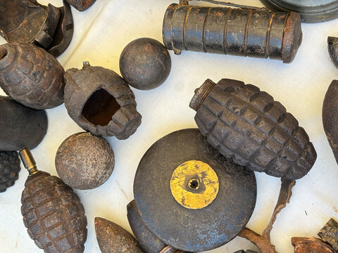 collection of rusty grenades and ammunition dating back to the two great world wars.