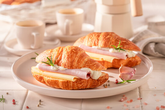Hot and tasty french croissant as a savory breakfast.