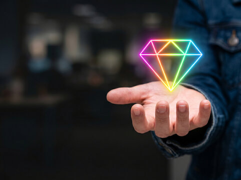 Start up bootstrap business neon diamond in open hand, glowing concept for growth and value