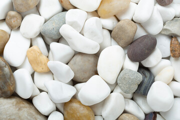 White pebble stones as background, top view © Liami