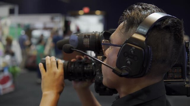 Professional camera operator filming live event