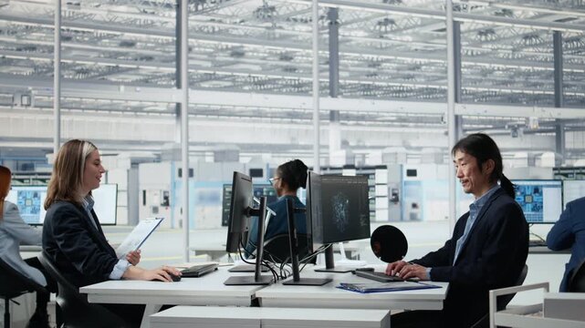 Senior manager analyzing chip architecture with AI model in microchip factory laboratory, manufacturing concept, Asian man programming PCB layout on PC in office with AI for semiconductor research.