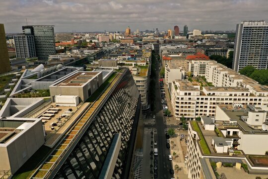 Aerial view of the Axel Springer Neubau building with its distinctive glass facade and modern rooftops overlooking the urban skyline of Berlin, Berlin, Germany.
