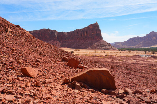 Red sandstone mountain slope and rocky desert landscape in Dadan area of AlUla, Saudi Arabia